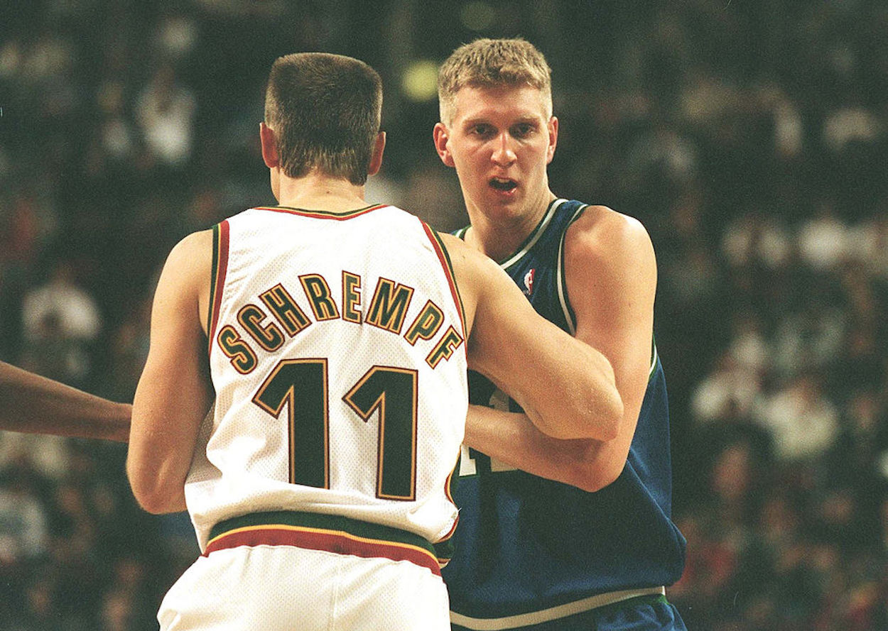 Detlef Schrempf (L) and Dirk Nowitzki (R) during an NBA game.