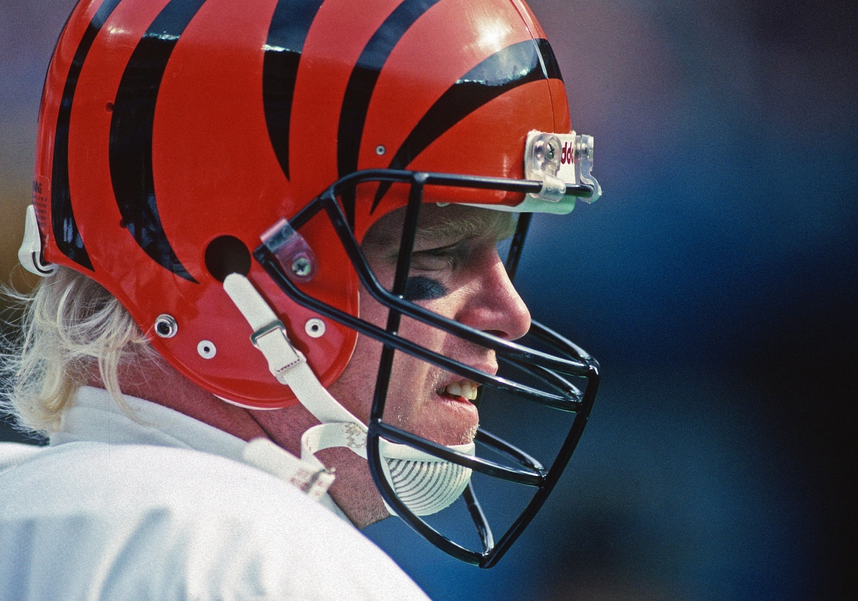 Quarterback Boomer Esiason of the Cincinnati Bengals looks on from the sideline.