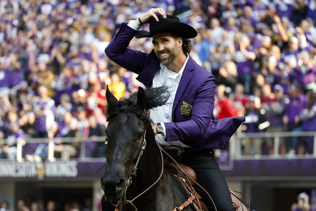 Jared Allen, former defensive end of the Minnesota Vikings, celebrates as he is inducted into the Vikings' Ring of Honor