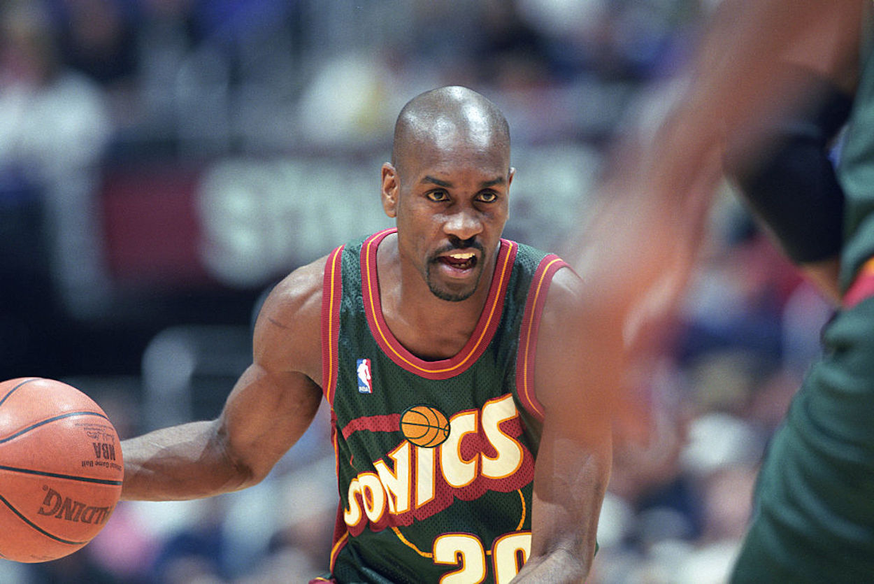 Gary Payton dribbles the ball up the court during his time with the Seattle SuperSonics.