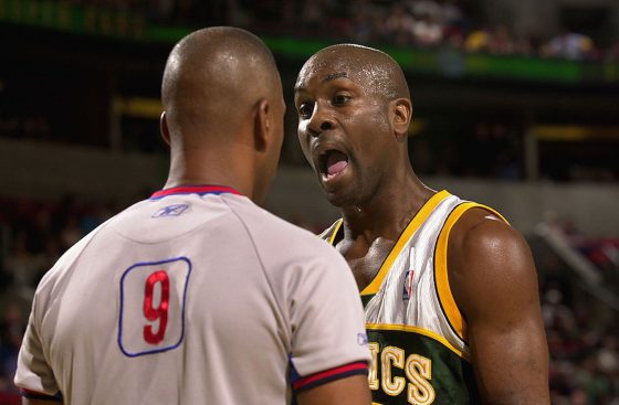 Gary Payton (R) argues with a referee during his time in the NBA.