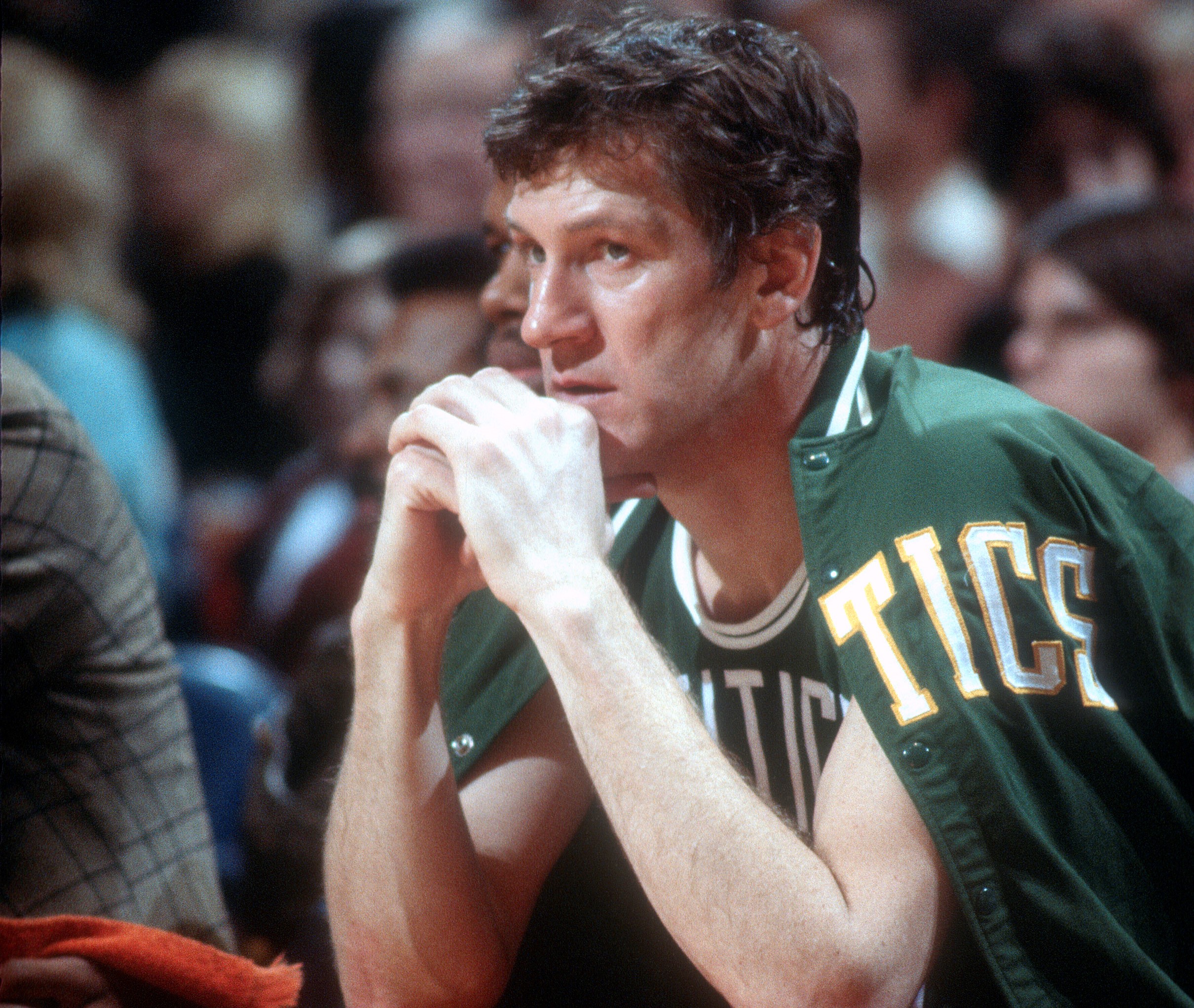 John Havlicek of the Boston Celtics looks on from the bench.