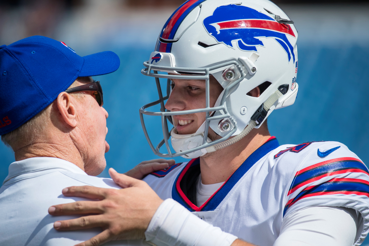 Hall of Famer Jim Kelly speaks with Josh Allen of the Buffalo Bills before the game against the Los Angeles Chargers at New Era Field on September 16, 2018.