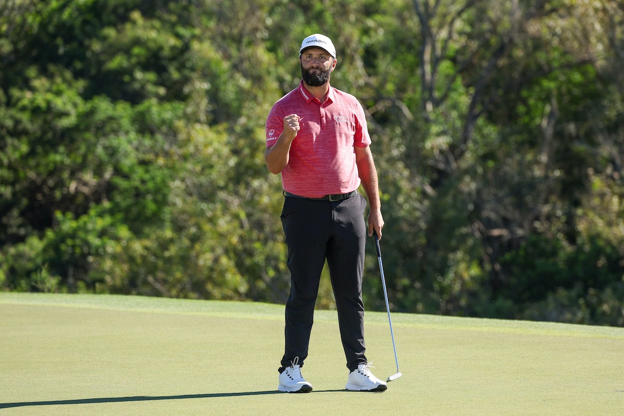 Jon Rahm celebrates after winning the Sentry Tournament of Champions.