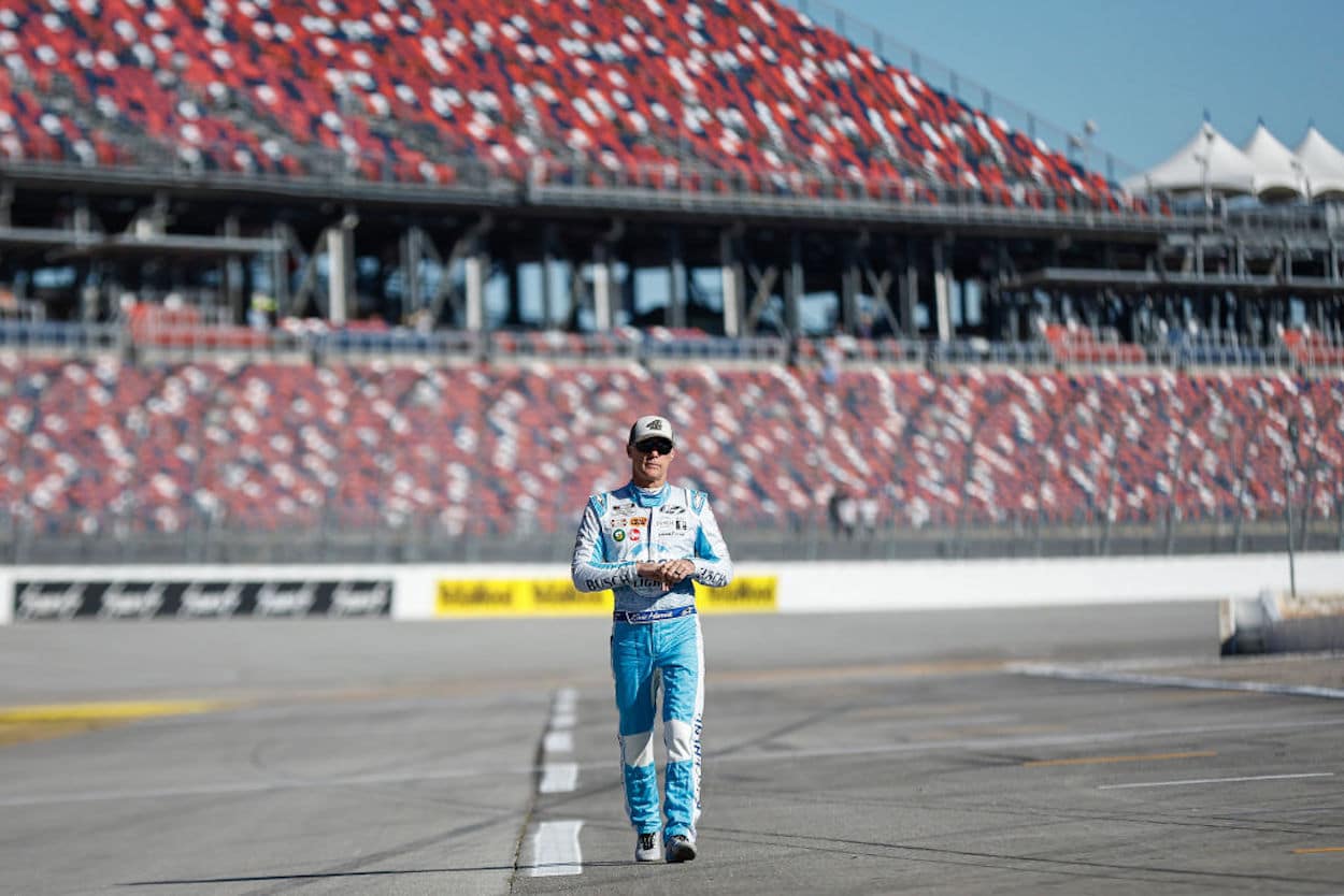 Kevin Harvick walks the grid ahead of the NASCAR Cup Series YellaWood 500.