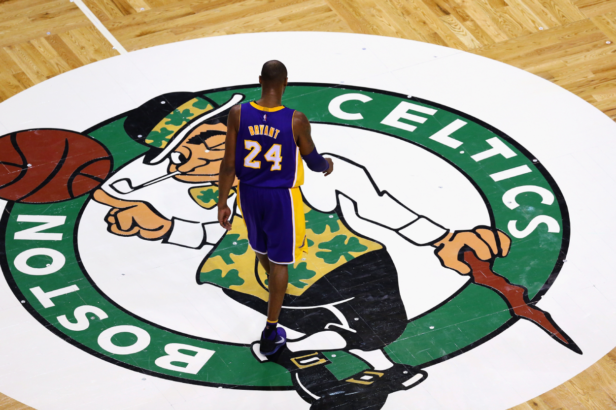 Kobe Bryant of the Los Angeles Lakers walks towards the bench during a timeout against the Boston Celtics.