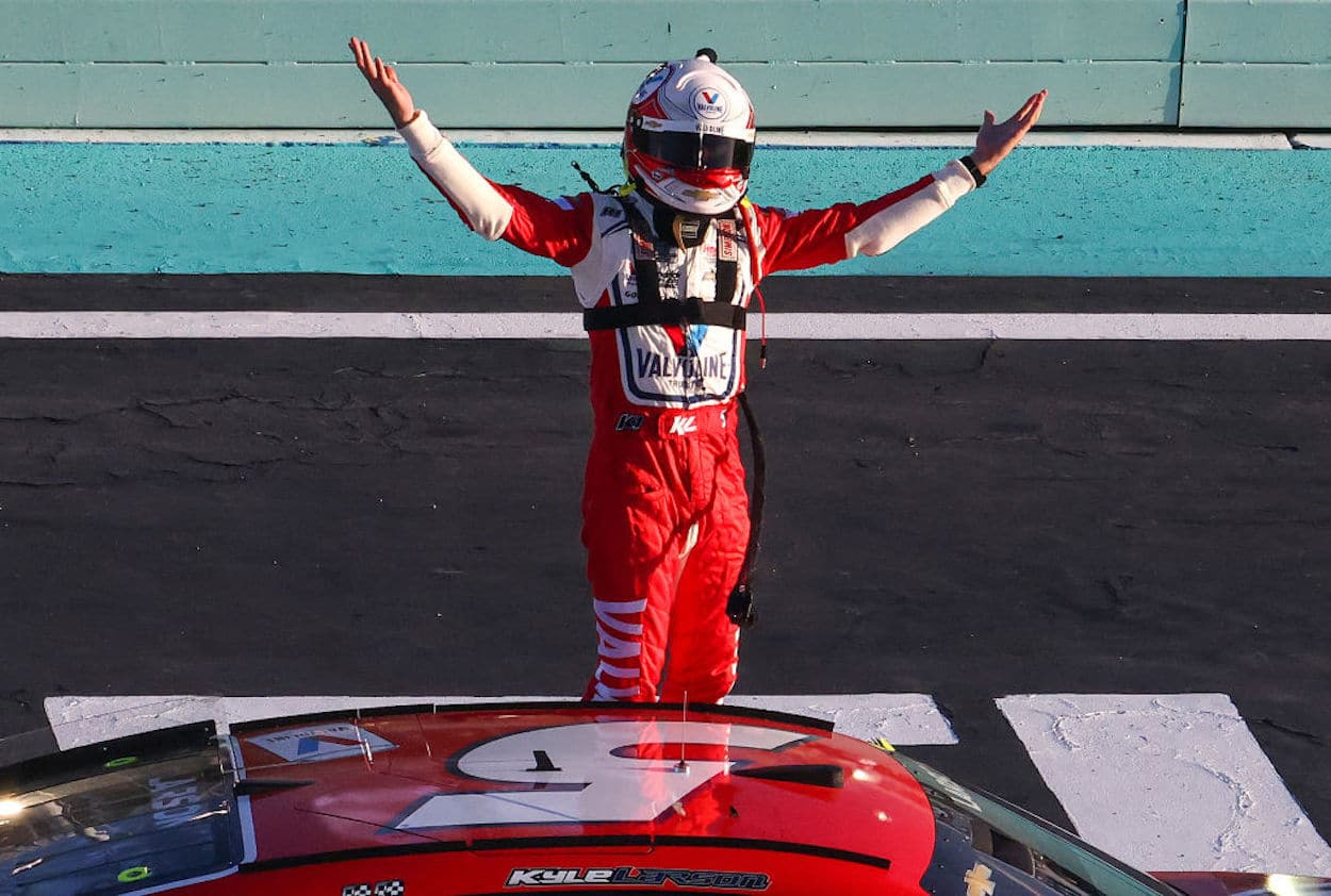 Kyle Larson celebrates victory in the NASCAR Cup Series Dixie Vodka 400.