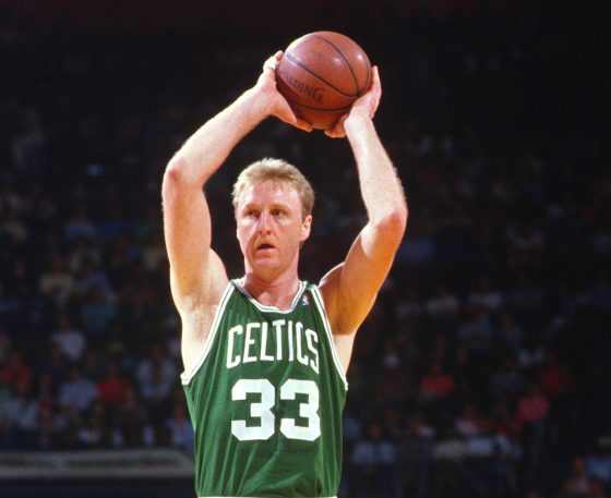 Larry Bird of the Boston Celtics looks to make a pass against the Washington Bullets.