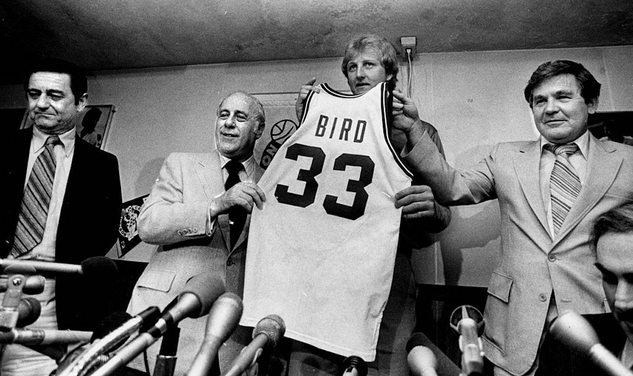 Larry Bird (C) is unveiled after signing with the Boston Celtics.