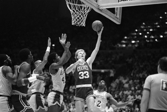 Larry Bird finishes at the rim against the Boston Celtics.