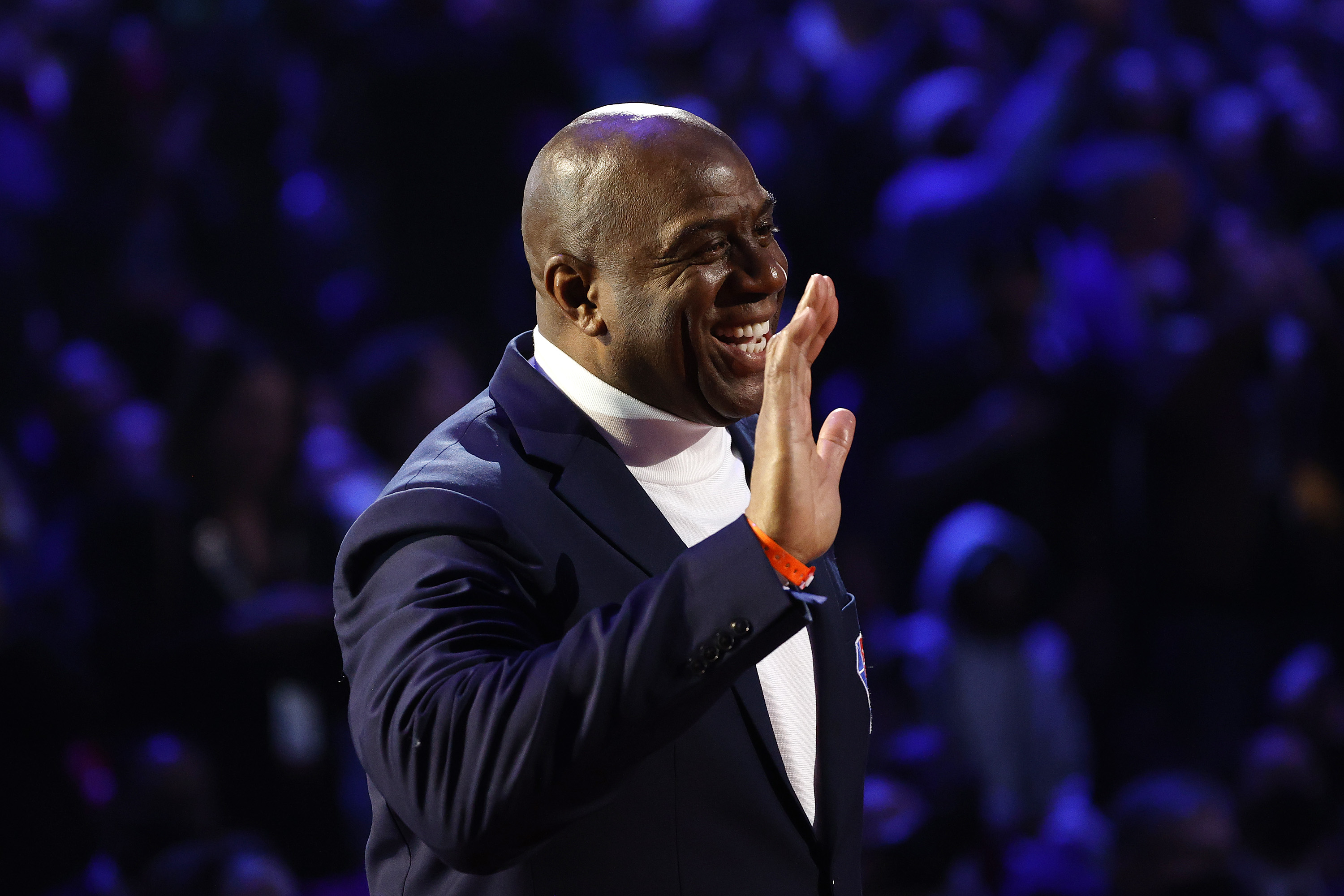Earvin "Magic" Johnson reacts after being introduced as part of the NBA 75th Anniversary Team.