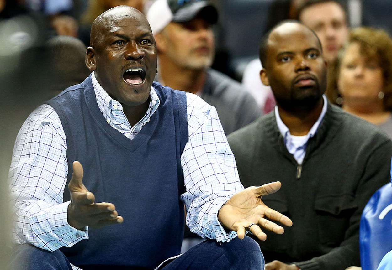 Michael Jordan reacts on the sidelines during a Charlotte Bobcats game.