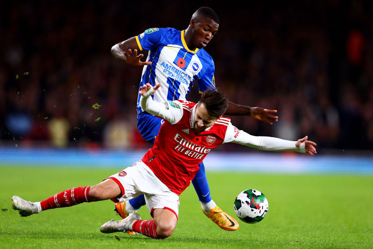 Moises Caideco (in blue) pressures Fabio Vieira during a match against Arsenal.