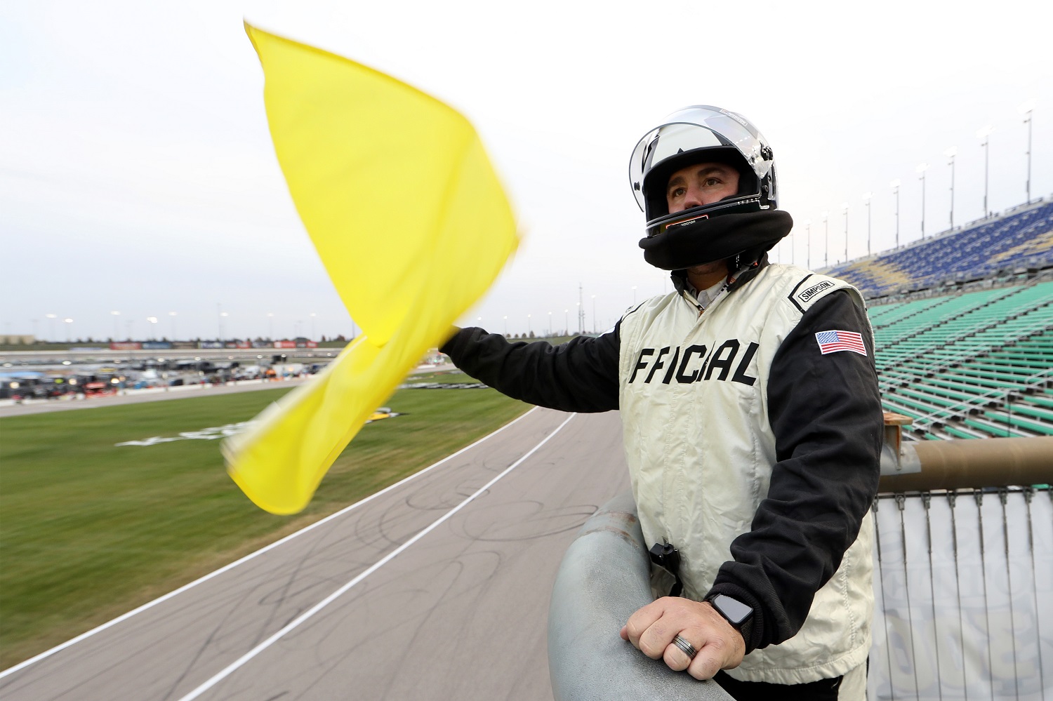 An official waves the caution flag from the flagstand during the NASCAR Xfinity Series Kansas Lottery 300 at Kansas Speedway on Oct. 17, 2020. | Jamie Squire/Getty Images