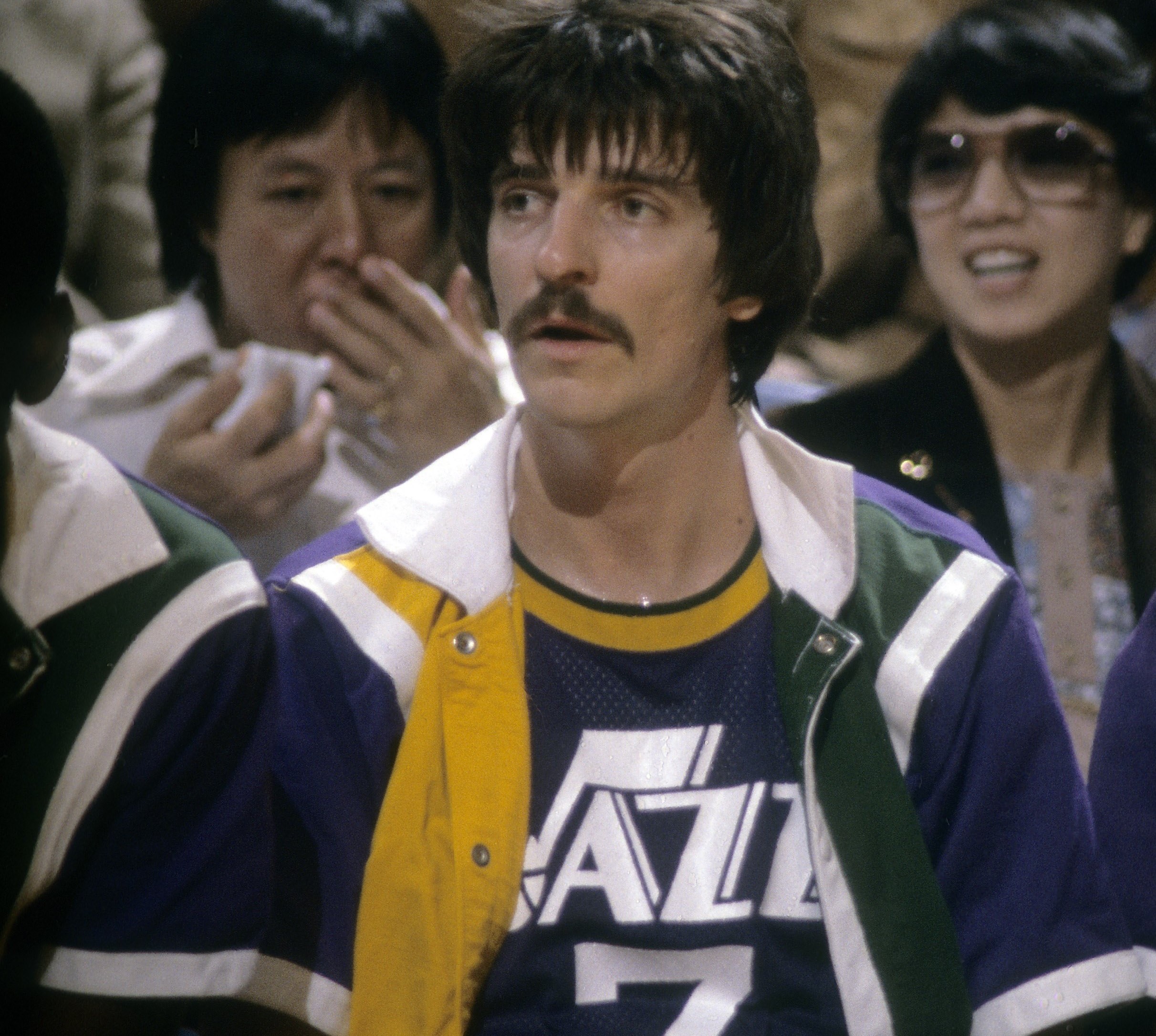 Pete Maravich of the New Orleans Jazz watches the action from the bench against the Washington Bullets.