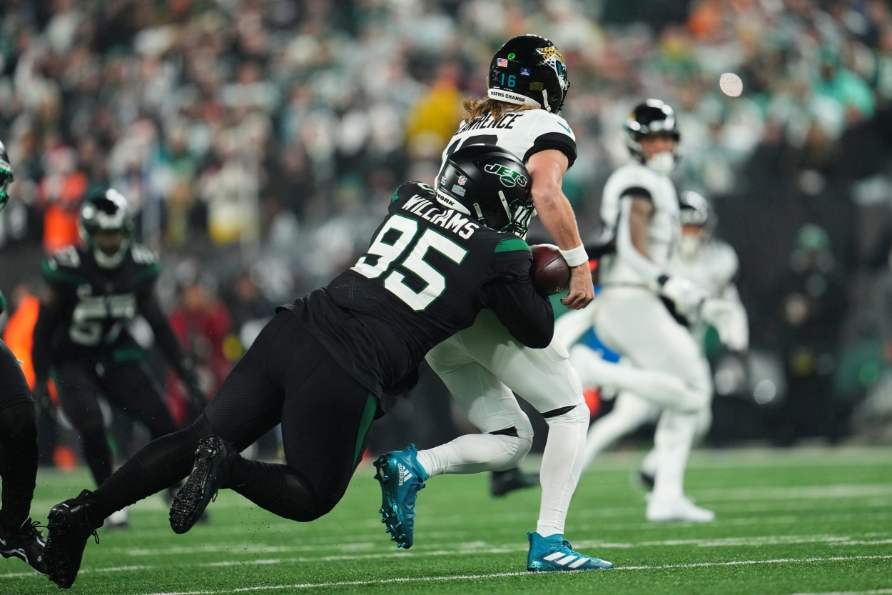 Quinnen Williams of the New York Jets strip sacks Trevor Lawrence of the Jacksonville Jaguars.