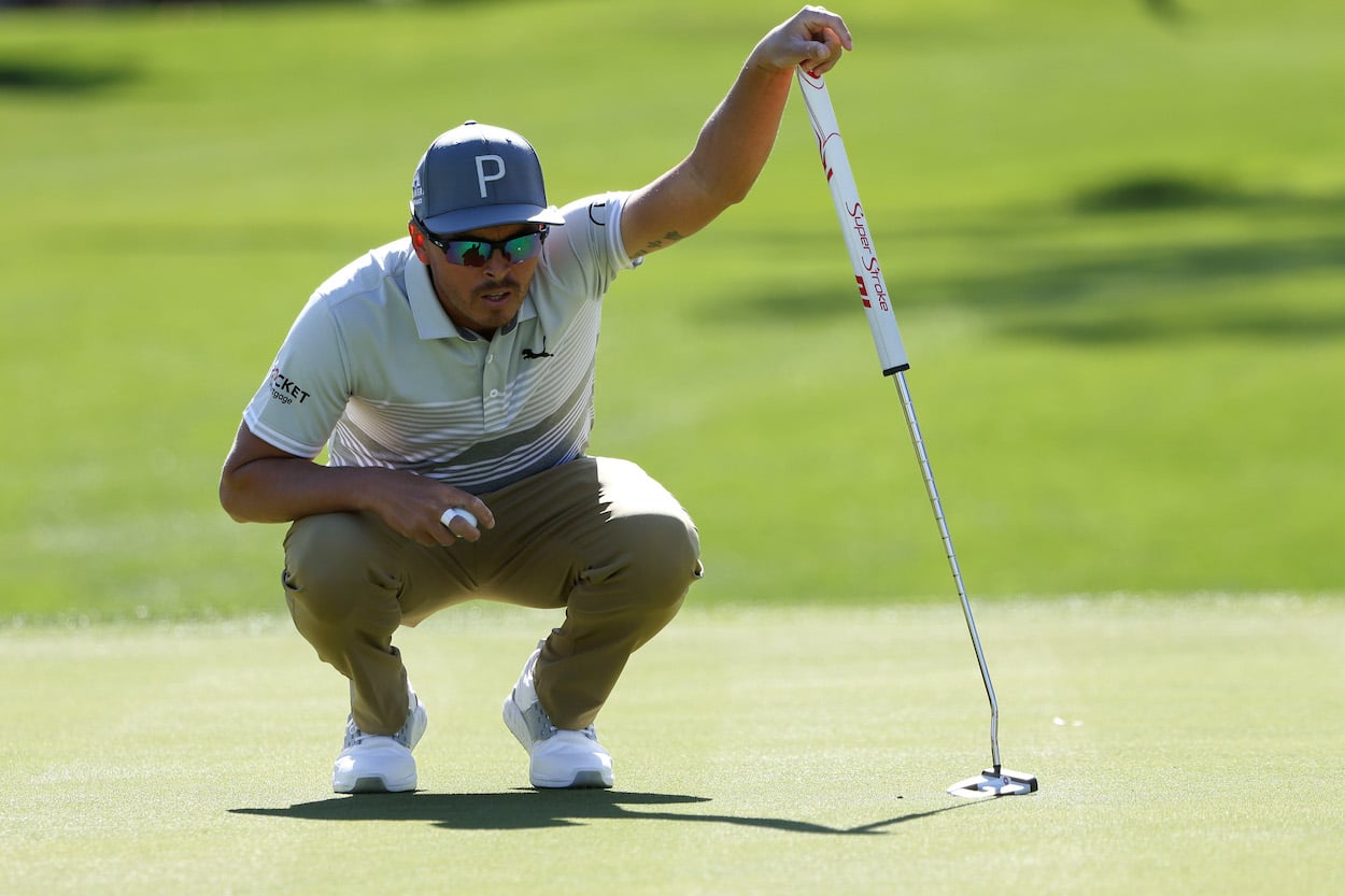 Rickie Fowler lines up a putt.