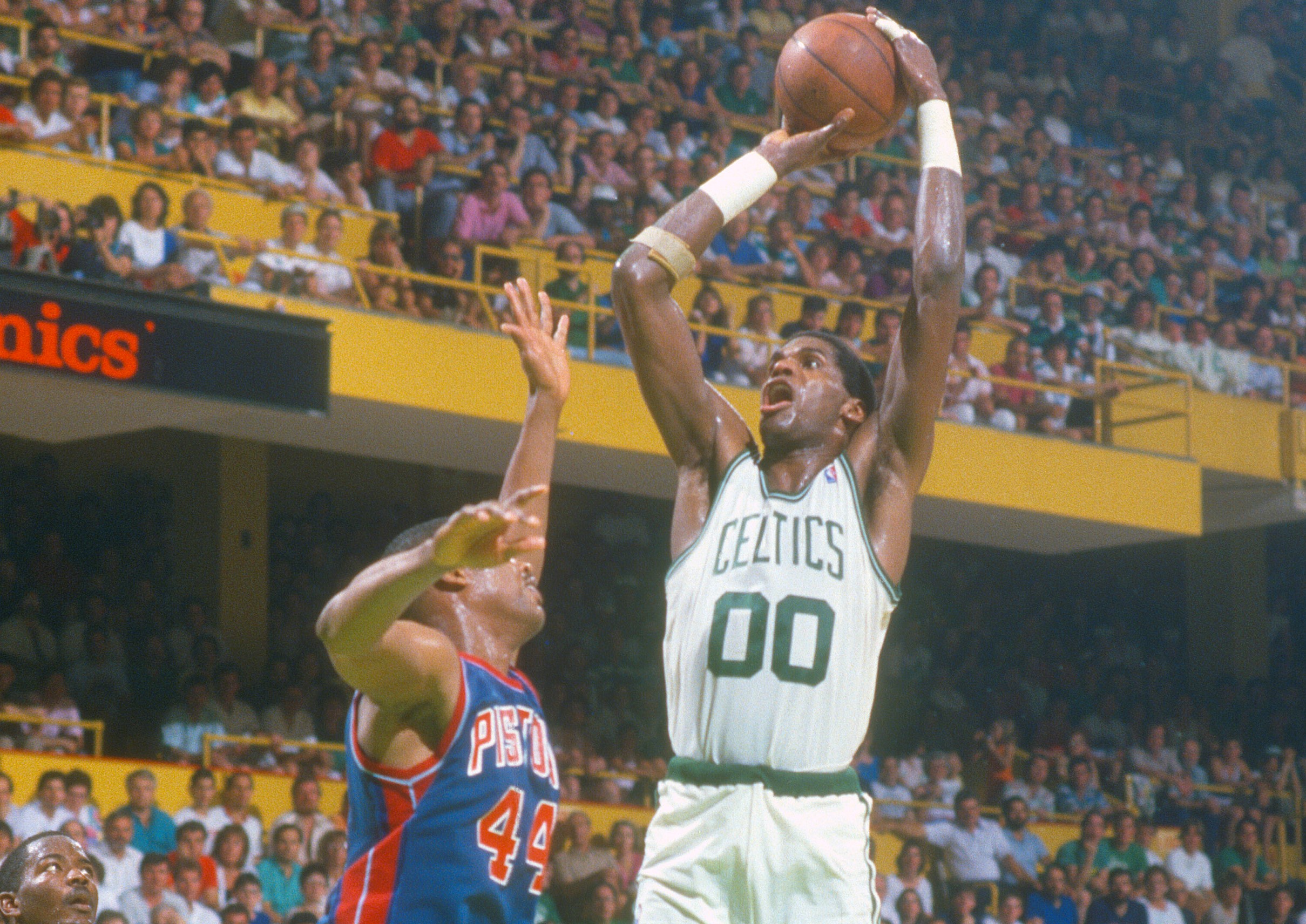 Robert Parish of the Boston Celtics shoots over Rick Mahorn of the Detroit Pistons.