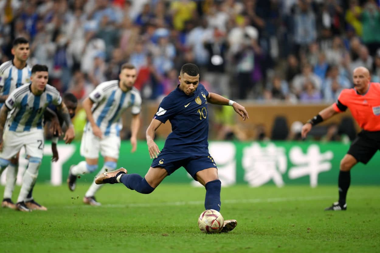 Kylian Mbappe scores a penalty kick for France during the 2022 FIFA World Cup Final.