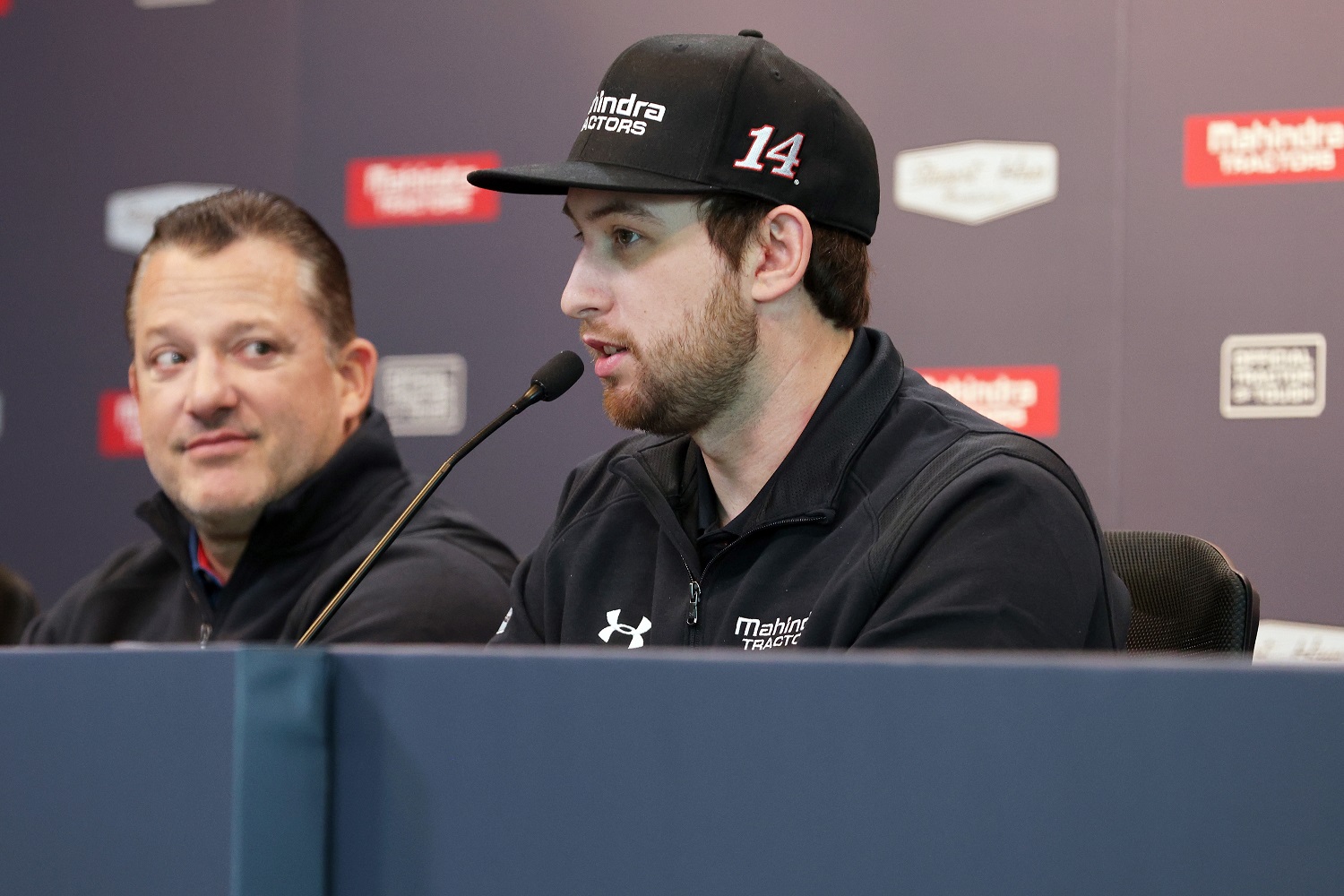 Chase Briscoe speaks as Tony Stewart looks on during a press event announcing a partnership between Stewart-Haas Racing and Mahindra Tractors on Dec. 10, 2021.
