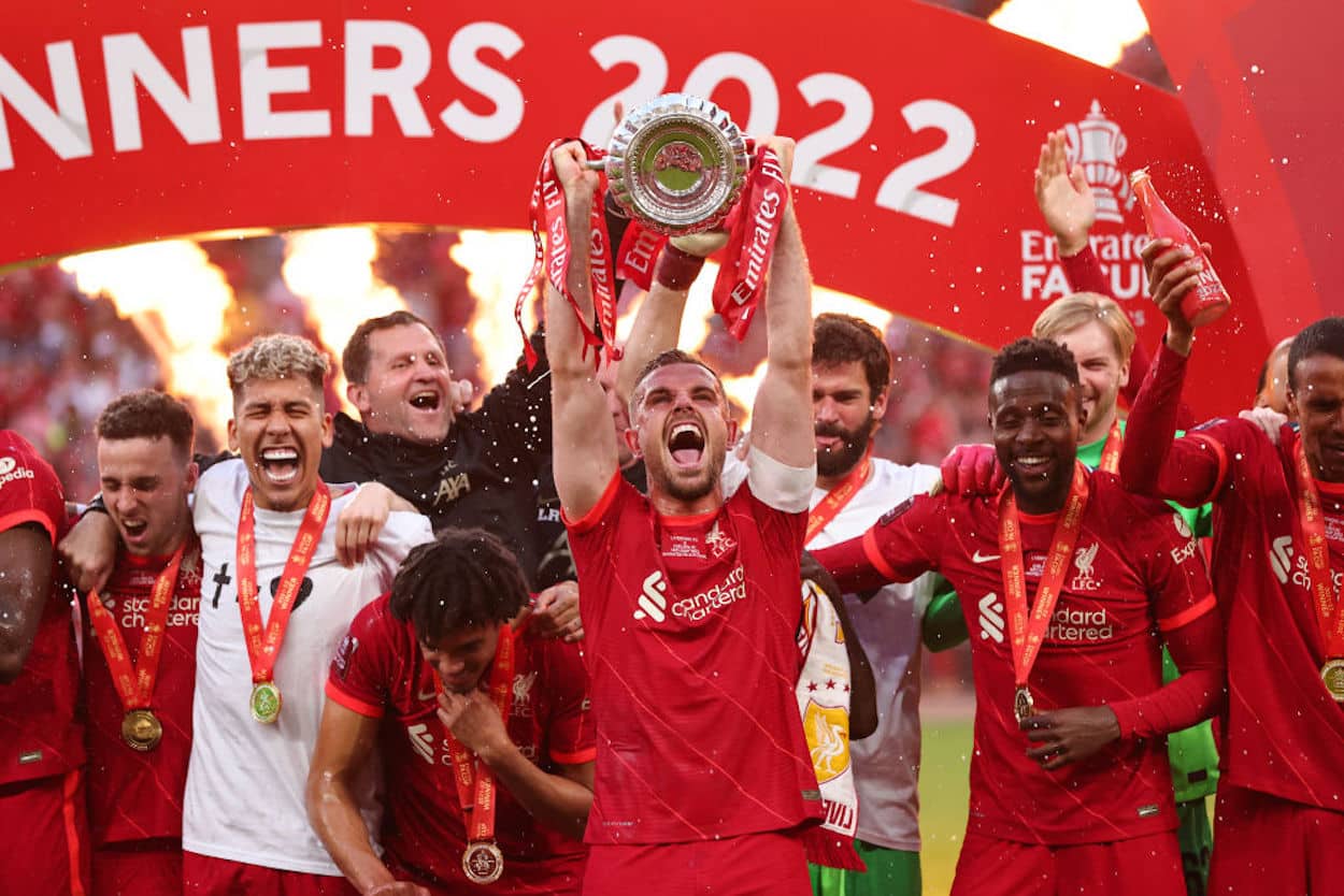 Jordan Henderson of Liverpool lifts the FA Cup in 2022.