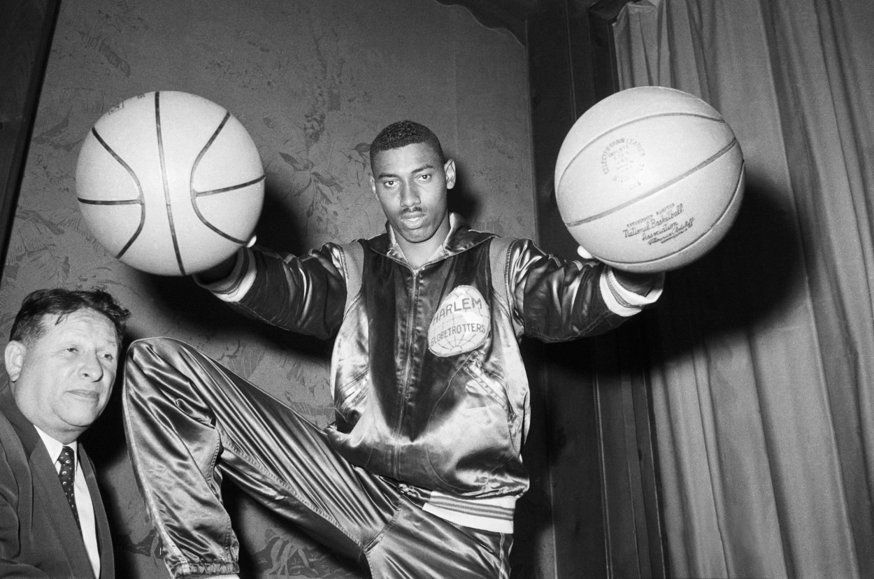 Wilt Chamberlain shows off his palming skills.