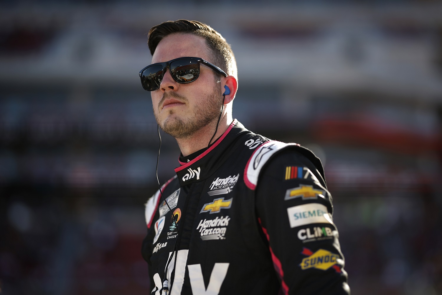 Alex Bowman, driver of the No. 48 Ally Chevrolet, looks on during qualifying heats for the NASCAR Busch Light Clash on Feb. 5, 2023.