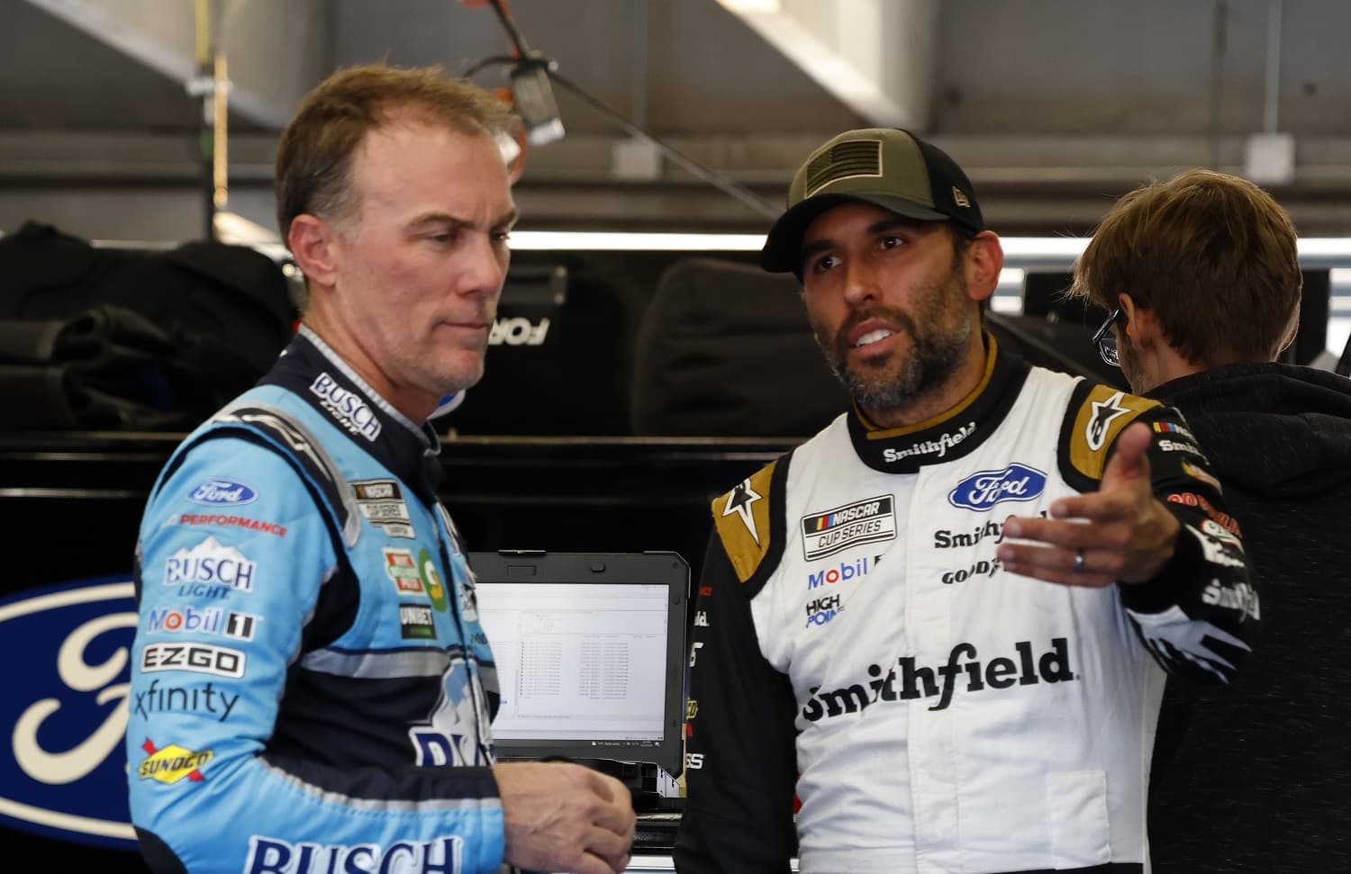 Kevin Harvick talks with Aric Almirola during NASCAR Cup Series Next Gen testing at Charlotte Motor Speedway on Nov. 17, 2021.