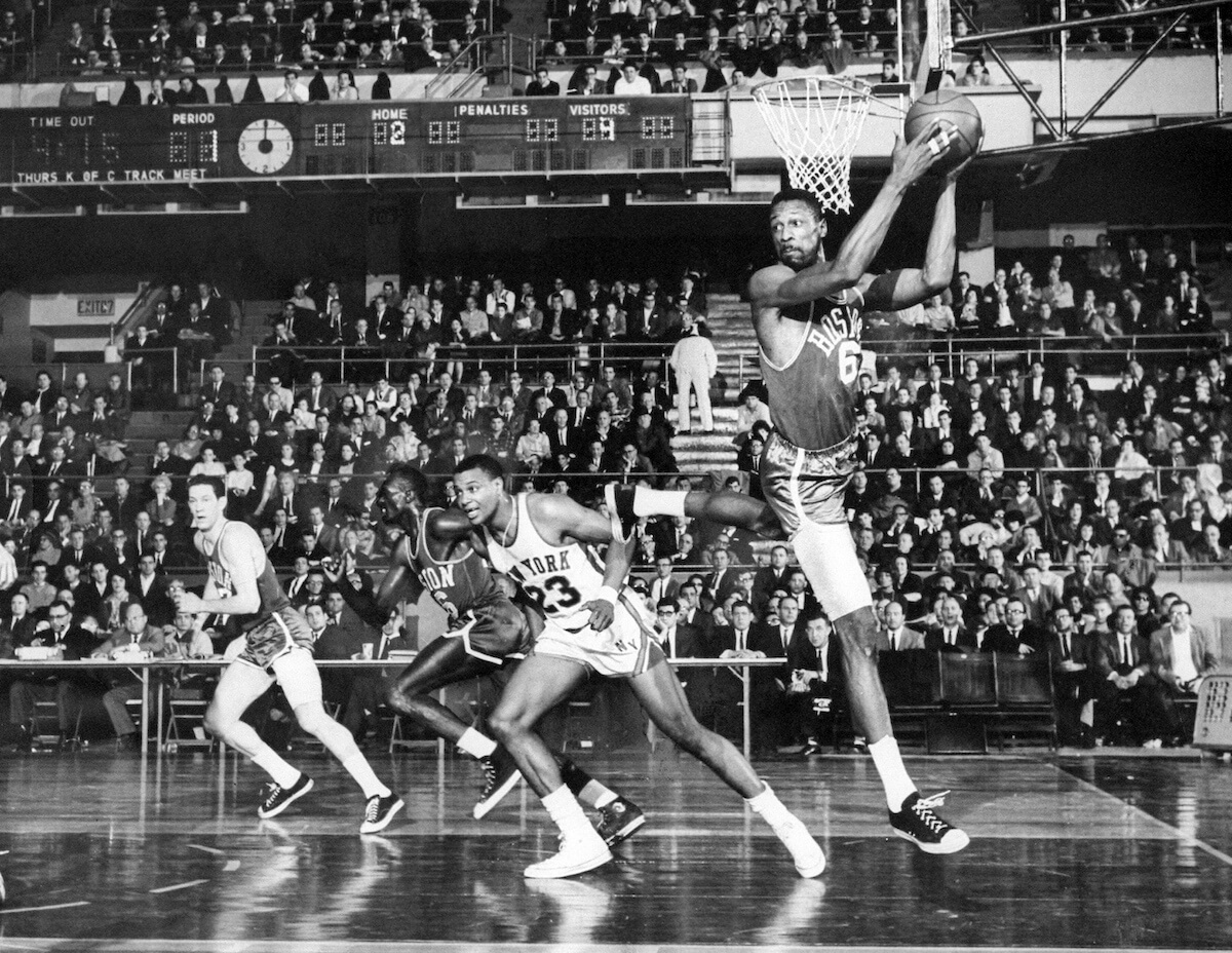 Bill Russell rebounds the basketball
