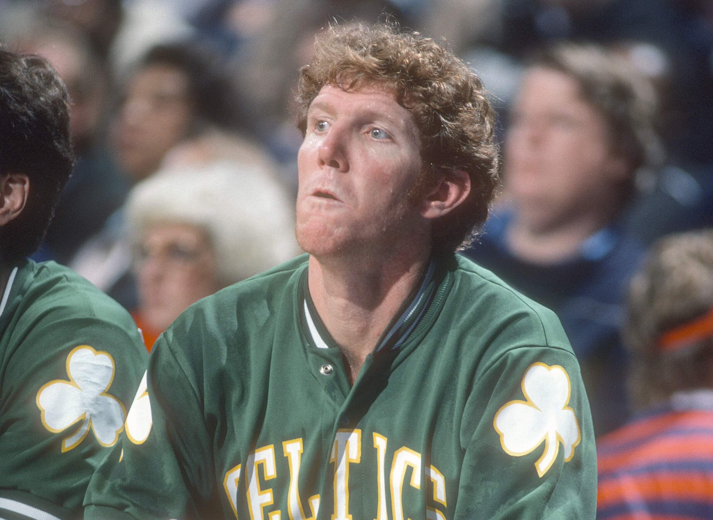 Bill Walton of the Boston Celtics looks on from the bench.
