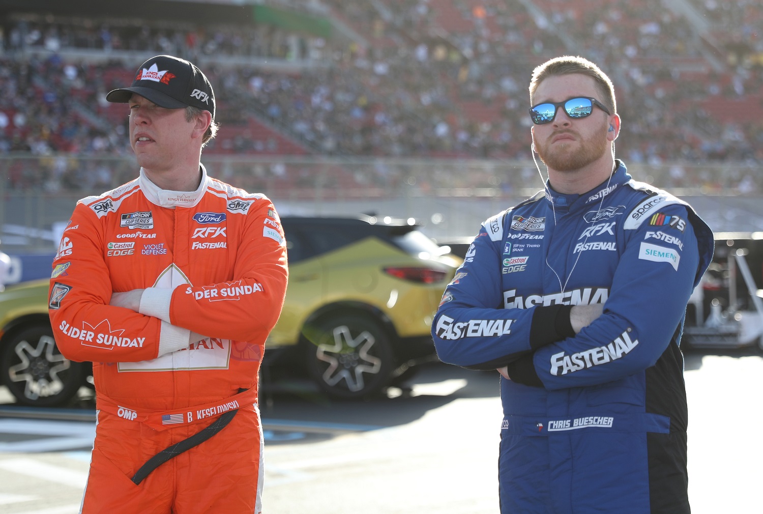 Brad Keselowski and Chris Buescher look on during qualifying heats for the Busch Light Clash at Los Angeles Coliseum on Feb. 5, 2023.