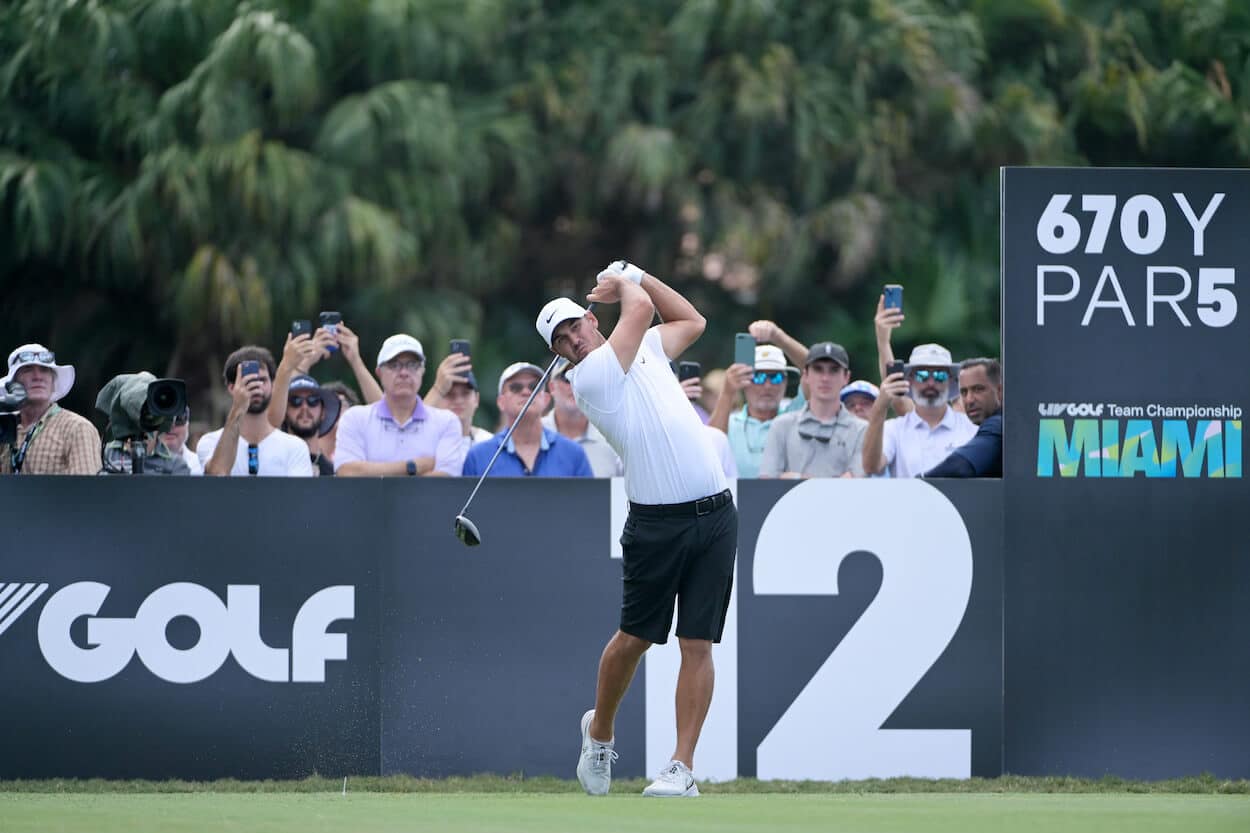 Brooks Koepka hits a drive during an LIV Golf event.