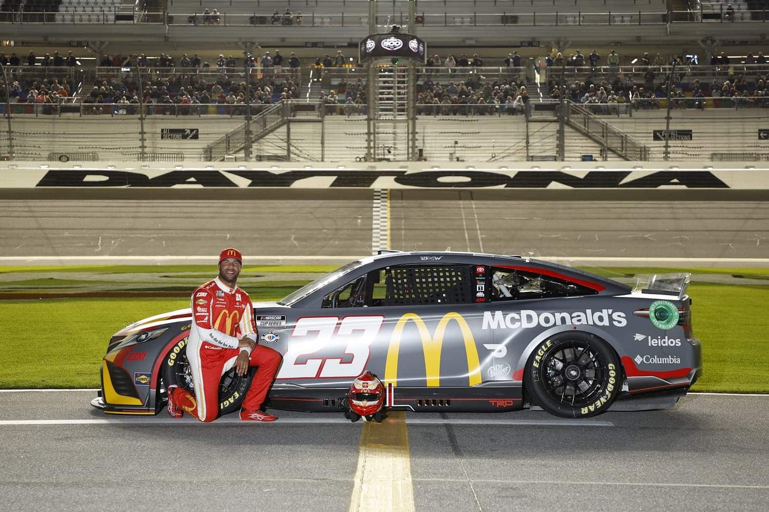 Bubba Wallace poses on the track during qualifying for the Busch Light Pole at Daytona International Speedway on Feb. 15, 2023.