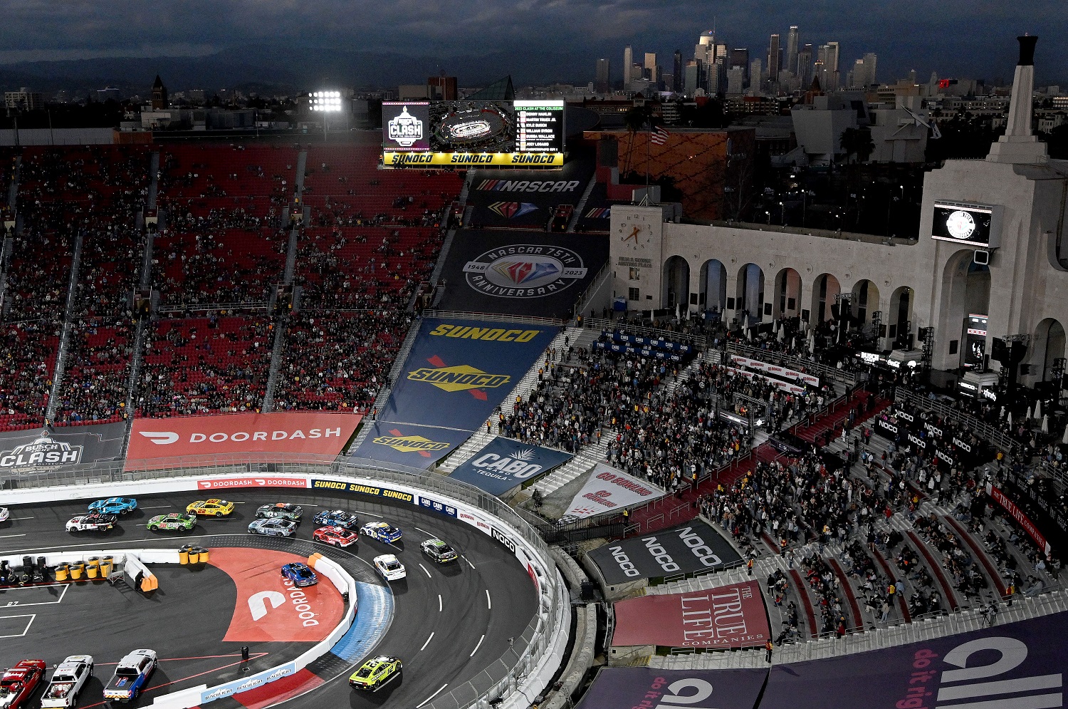 Drivers navigate the oval during the early laps of the NASCAR Busch Light Clash at the Los Angeles Memorial Coliseum on Feb. 5, 2023.