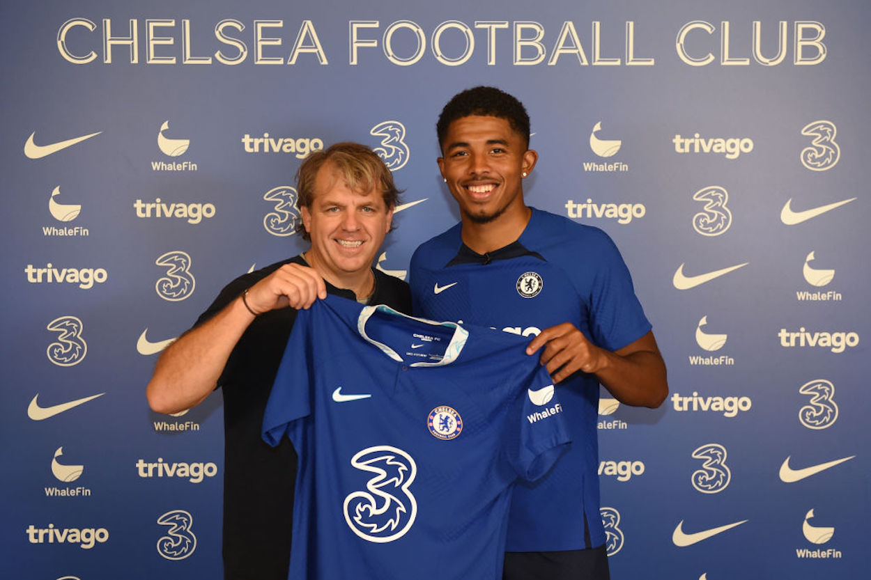 Chelsea owner Todd Boehly (L) unveils new signing Wesley Fofana (R).