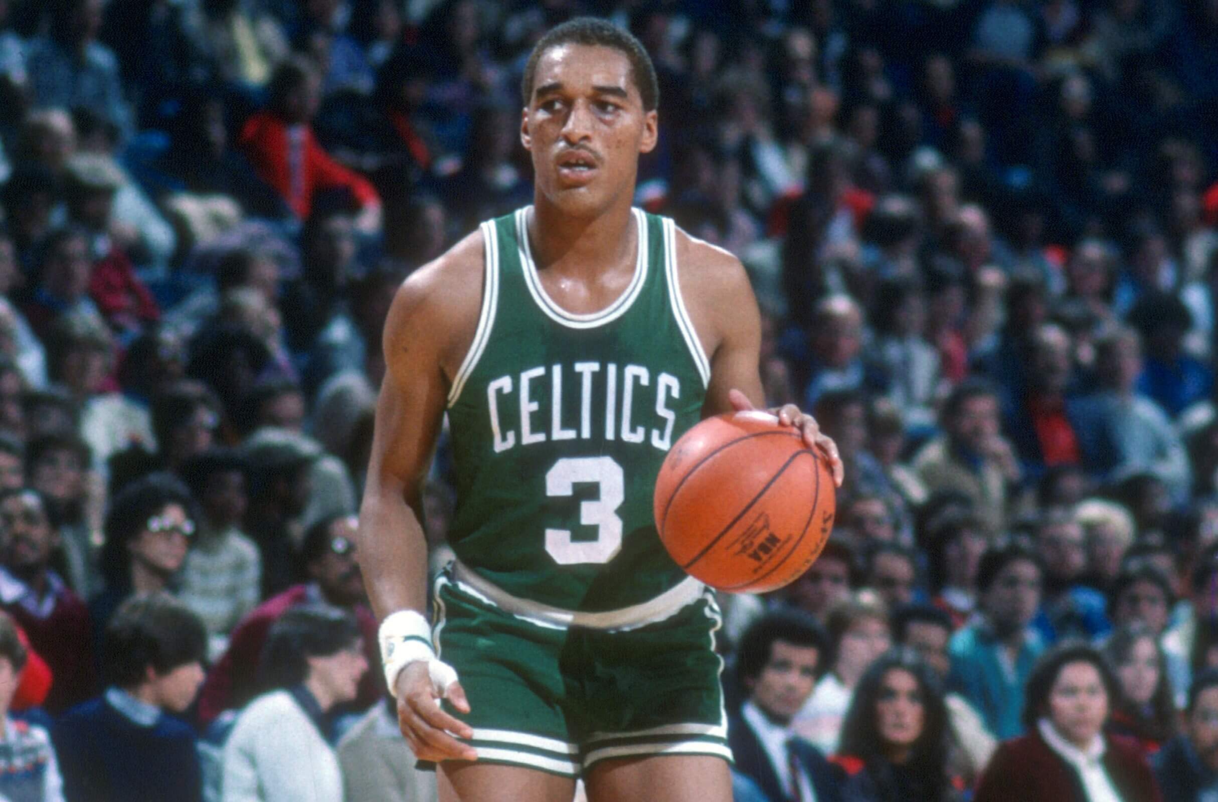 Dennis Johnson of the Boston Celtics dribbles the ball.