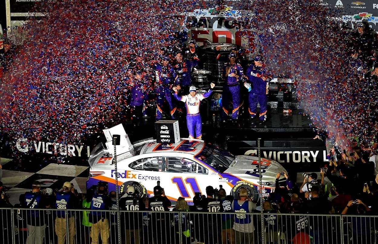 Denny Hamlin celebrates in Victory Lane after winning the NASCAR Cup Series Daytona 500 on Feb. 17, 2020.