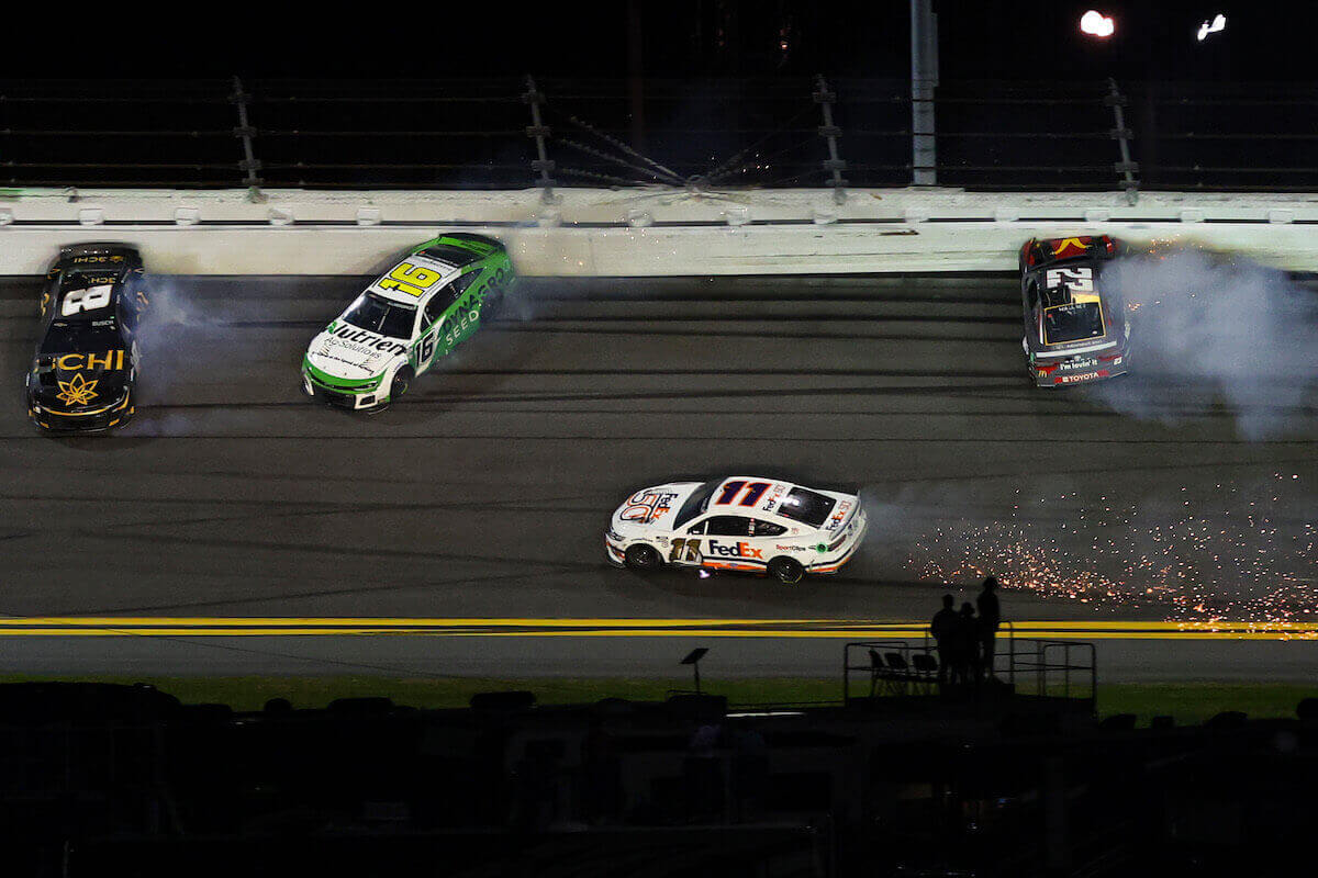 Kyle Busch, AJ Allmendinger, Denny Hamlin, and Bubba Wallace spin after an on-track crash at the Daytona 500.