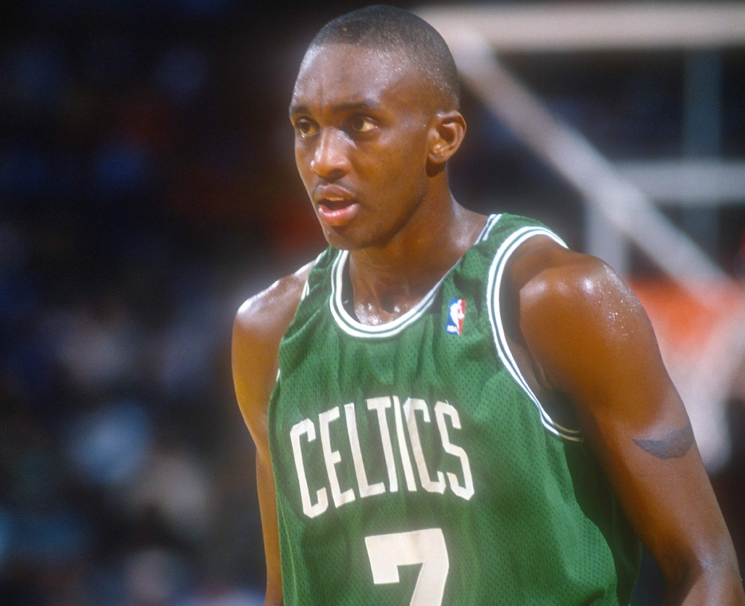 Dee Brown of the Boston Celtics looks on against the Washington Bullets.