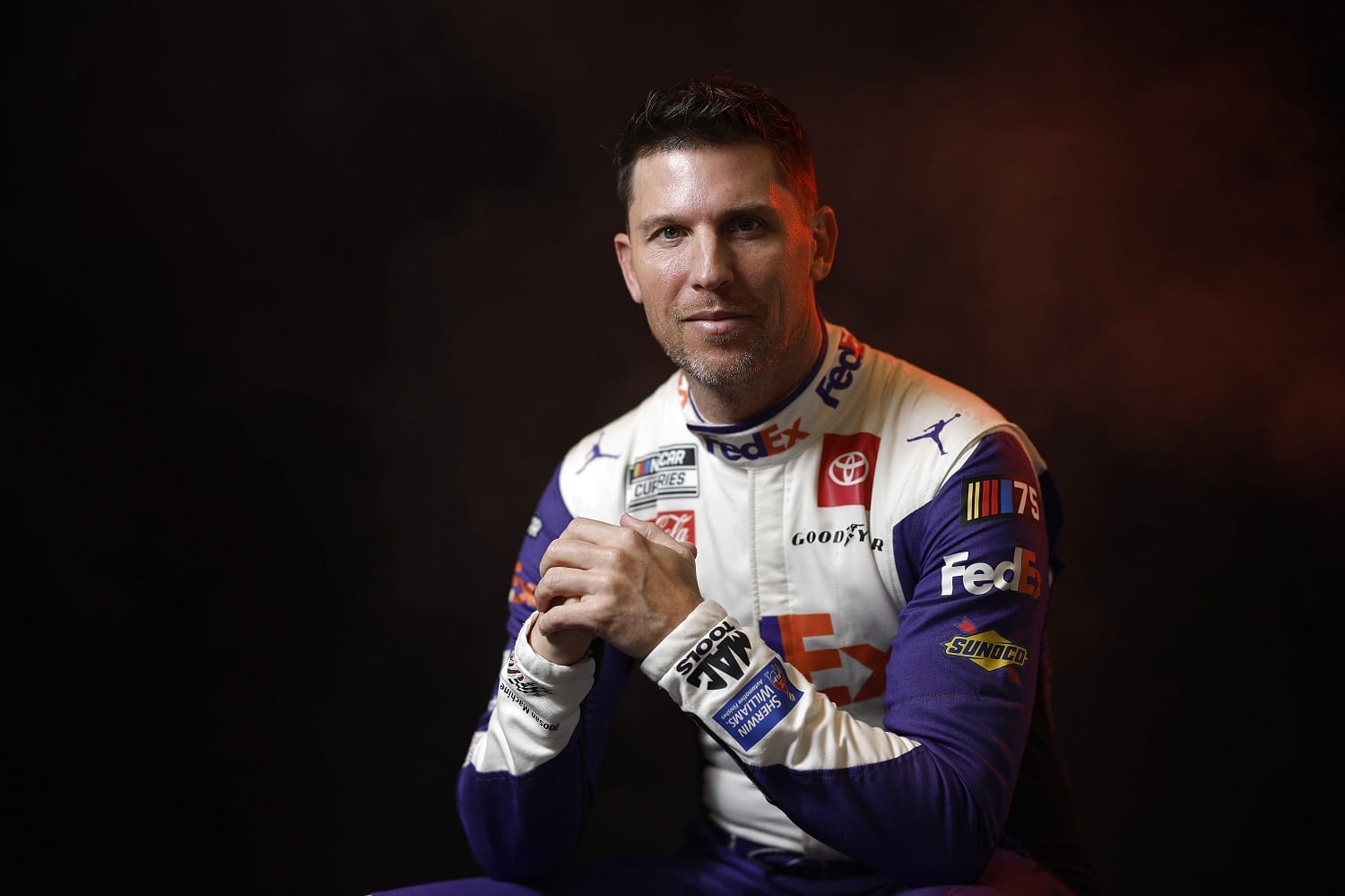 Denny Hamlin poses for a photo during NASCAR Production Days at Charlotte Convention Center on Jan. 18, 2023.