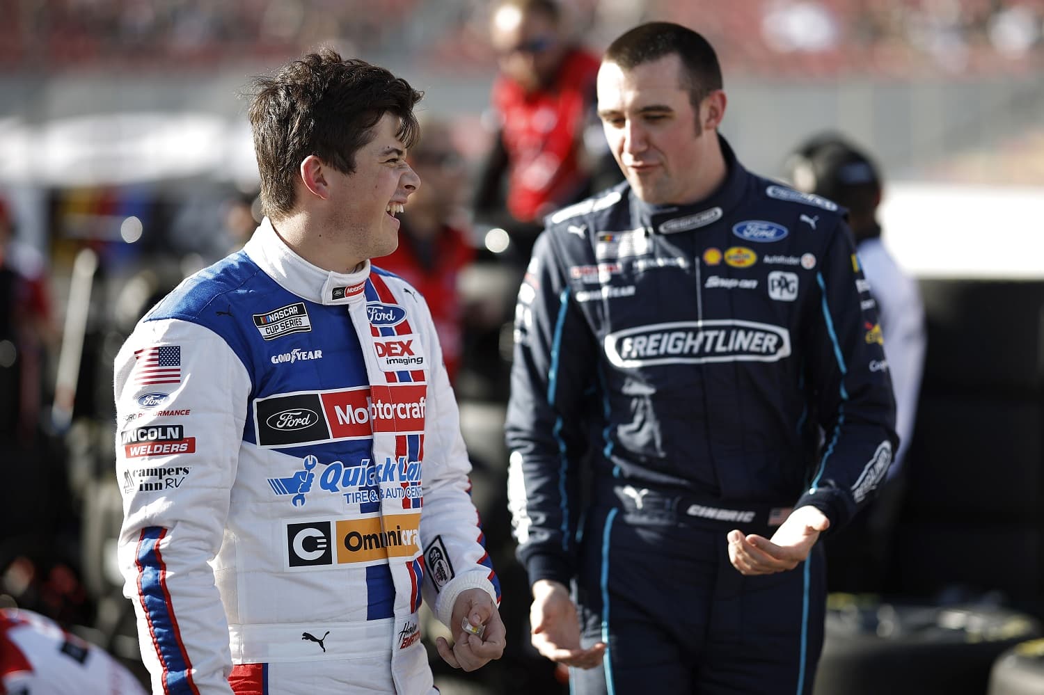 Harrison Burton and Austin Cindric talk during qualifying heats for the NASCAR Clash at the Coliseum at Los Angeles Memorial Coliseum on Feb. 5, 2023.