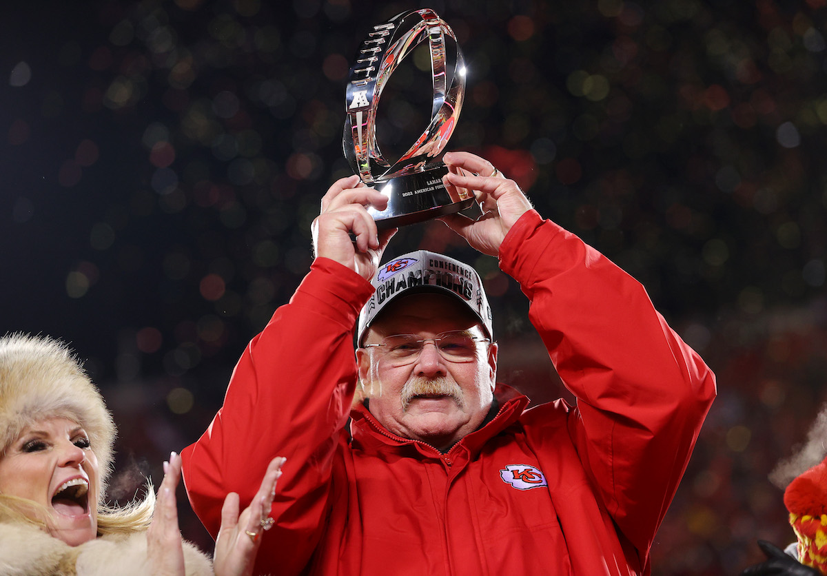 Head coach Andy Reid of the Kansas City Chiefs holds up the Lamar Hunt Trophy after winning the AFC Championship Game against the Cincinnati Bengals