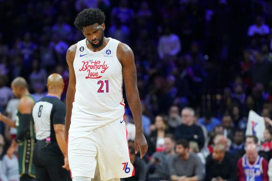 Joel Embiid walks off the court against the Celtics.