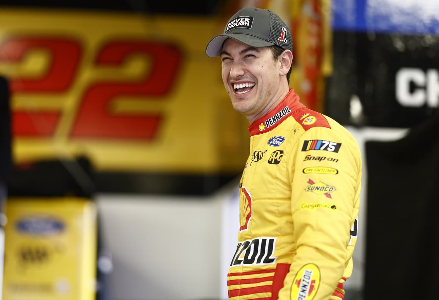 Joey Logano laughs in the garage area during practice for the NASCAR Cup Series Daytona 500 on Feb. 17, 2023.