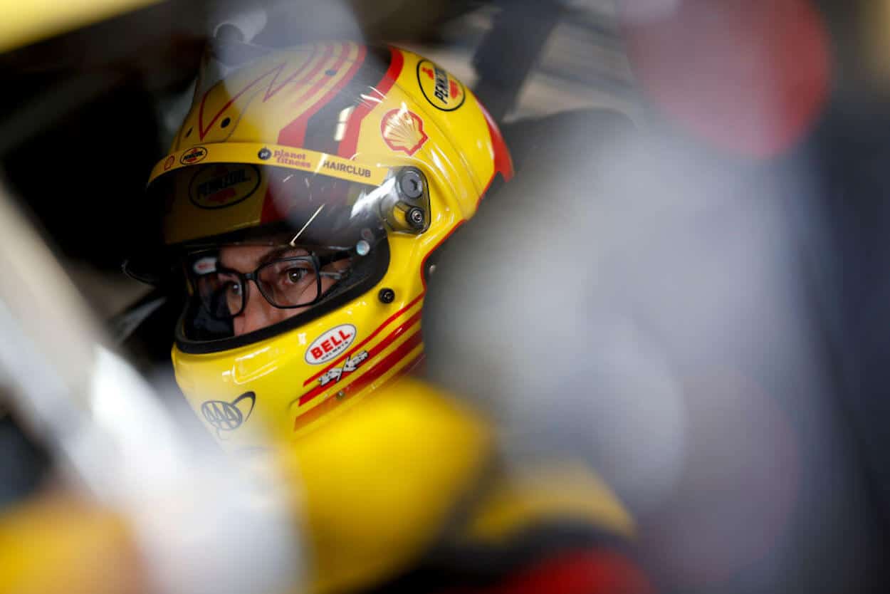 Joey Logano sits in his car ahead of the Daytona 500.