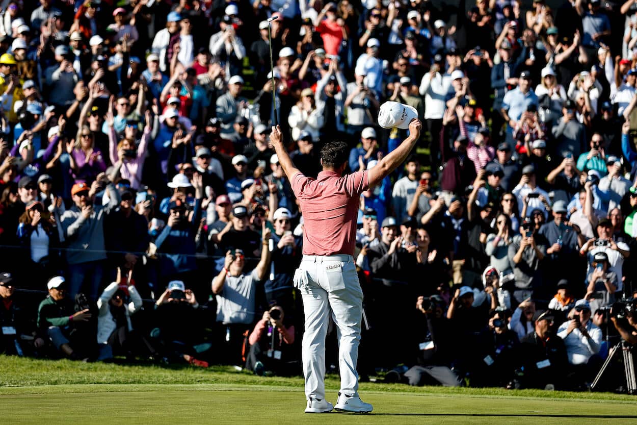 Jon Rahm celebrates after winning the Genesis Invitational.