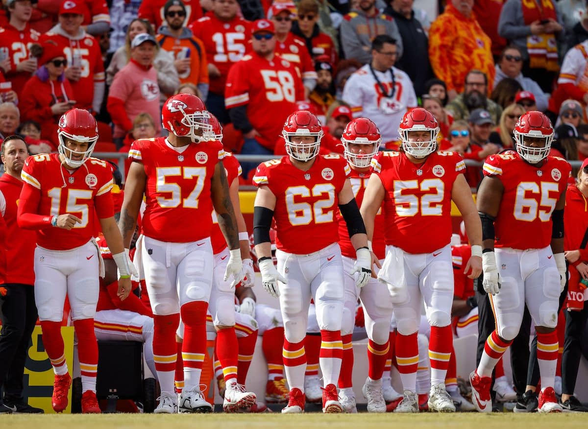 Kansas City Chiefs players Orlando Brown Jr., Joe Thuney, Creed Humphrey, Andrew Wylie, and Trey Smith walk on to the field