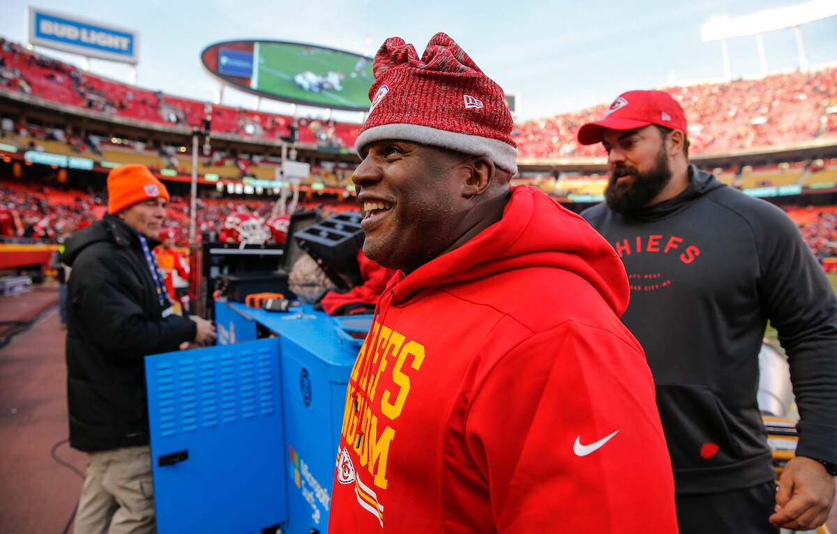 Chiefs offensive coordinator Eric Bieniemy smiles as he walks off the field after a win