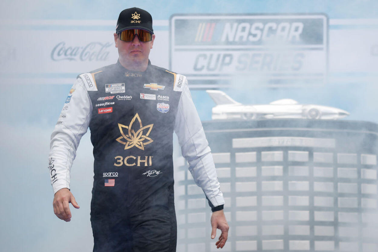 Kyle Busch walks on stage ahead of the 2023 Daytona 500.