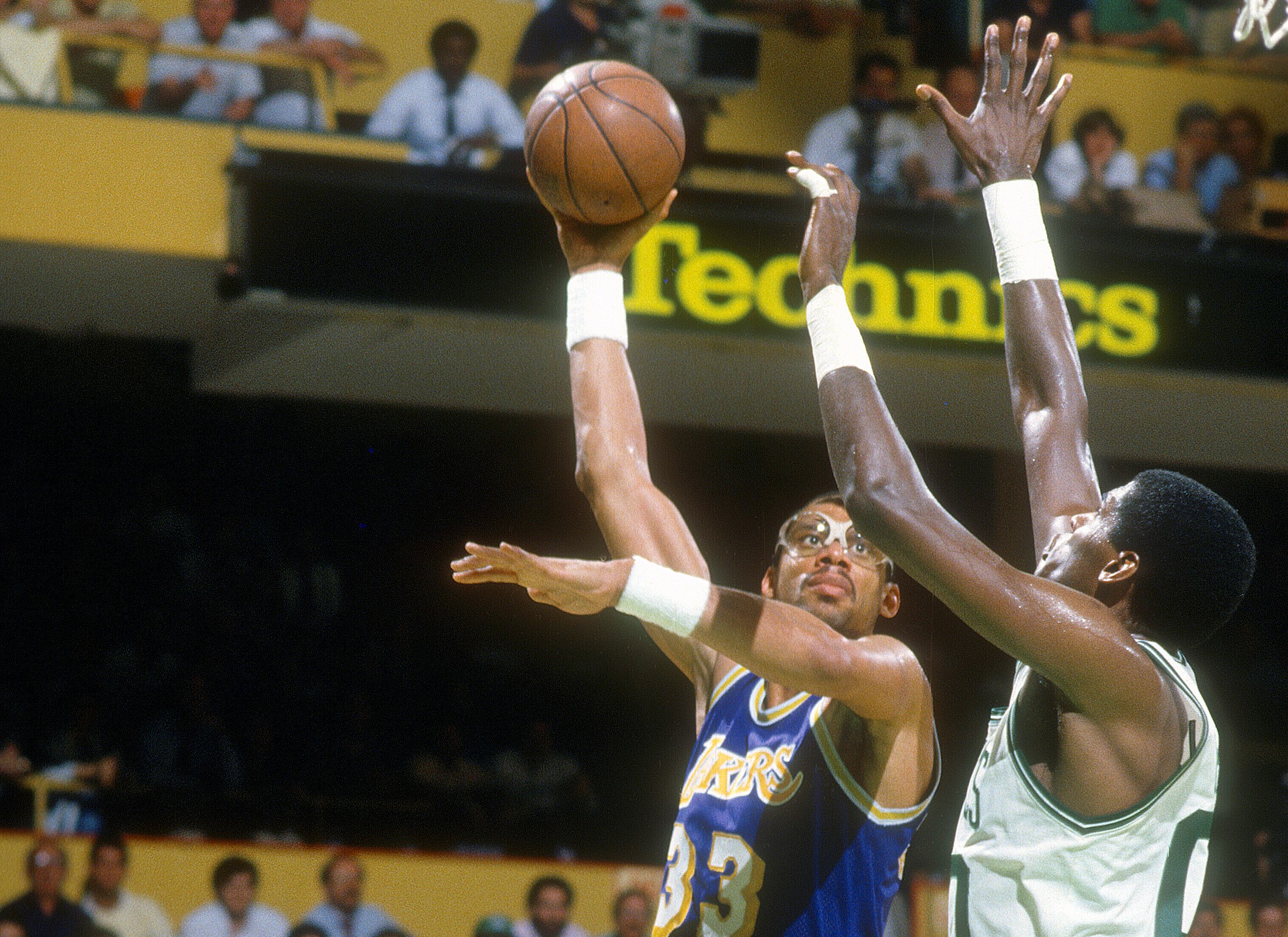 Kareem Abdul-Jabbar of the Los Angeles Lakers shoots over Robert Parish of the Boston Celtics.
